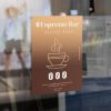 Removable window cling featuring an espresso bar and coffee shop design