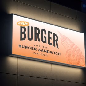 Custom design lightbox shop sign featuring burger branding graphics and professional display layout