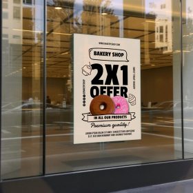 Bakery window cling with a doughnut illustration and a “2X1 OFFER” message.