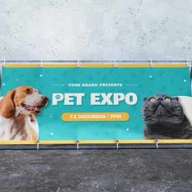 Wide outdoor metal A-frame with a turquoise pet expo banner.