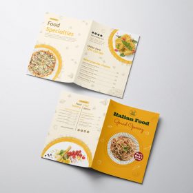 Open yellow and cream folded food menu with dish photographs.