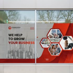 Red and white business graphics covering the lower storefront windows.