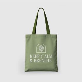 Green tote bag with white “KEEP CALM & BREATHE” artwork.