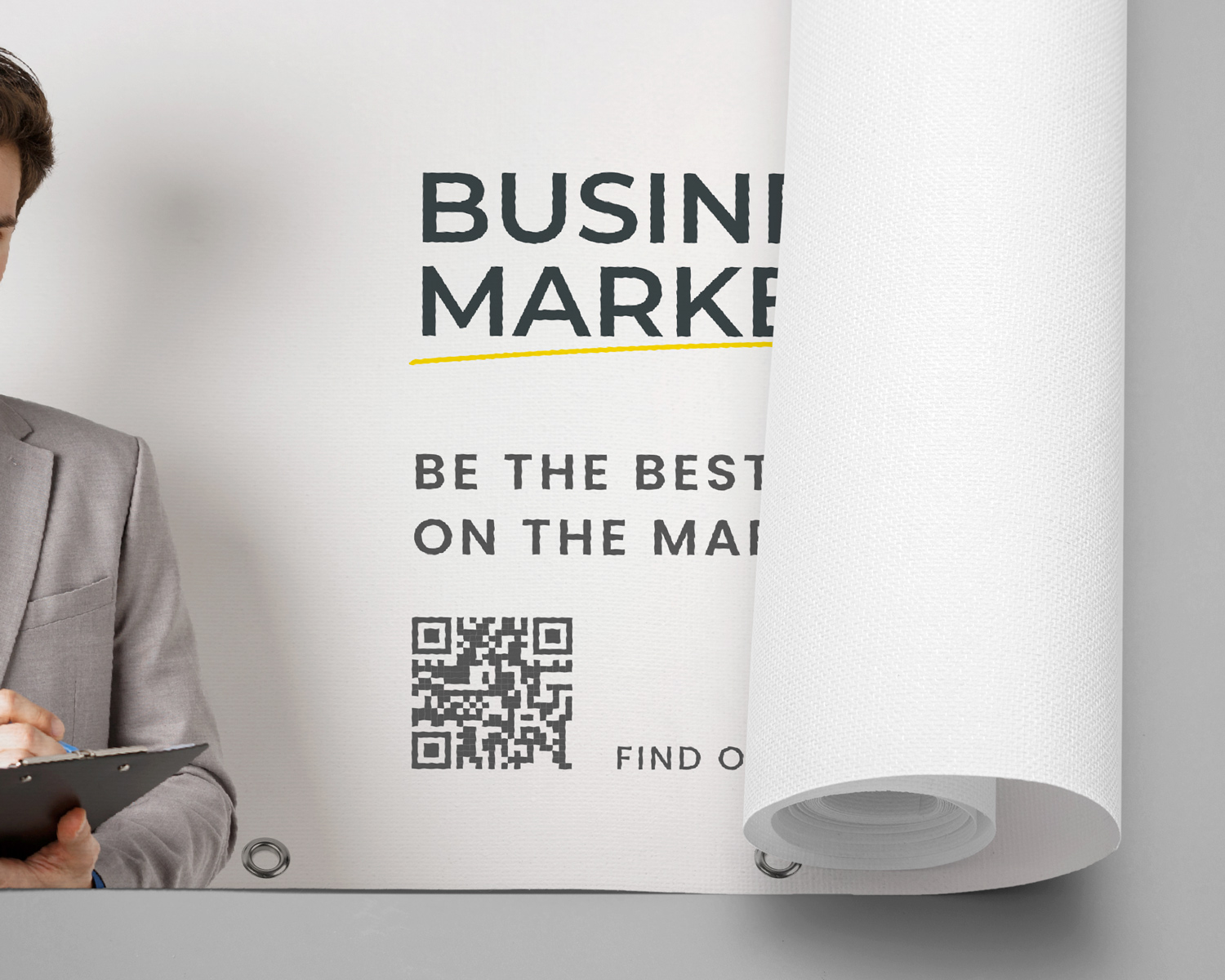 Close-up of a rolled printed banner with a QR code and business graphics.