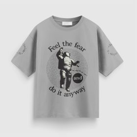 Gray T-shirt with an astronaut illustration and “Feel the fear and do it anyway” lettering.
