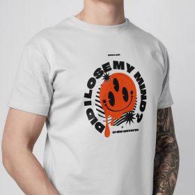 Person wearing a white T-shirt with an orange smiley graphic.
