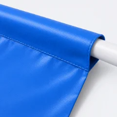 Banner with a sewn pole pocket and a pole inserted