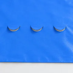 Vinyl banner with half-moon wind slits