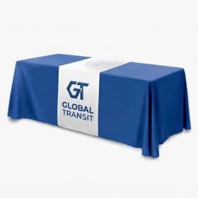 Custom printed table runner with a logo on a blue tablecloth
