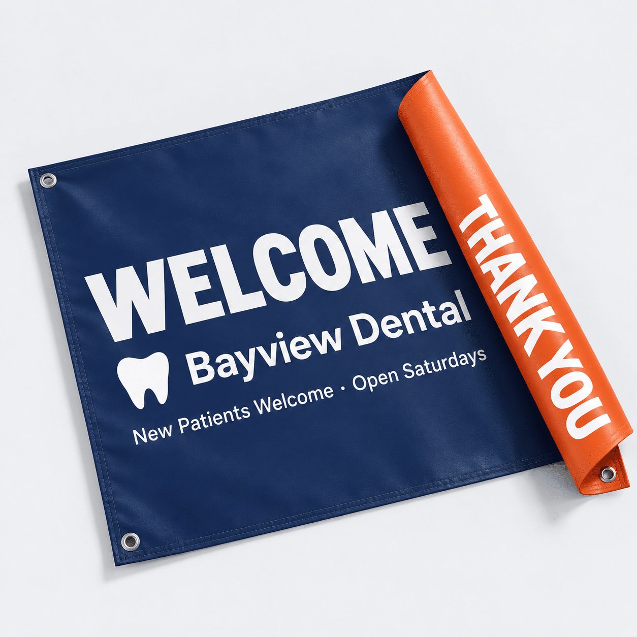 Double-sided vinyl banner with a rolled edge showing a navy Welcome front and orange Thank You back